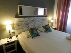Llit o llits en una habitació de Oasis Backpackers' Toledo