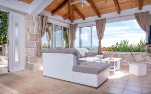 a living room with a couch and a table at Apartment Spila in Ivan Dolac