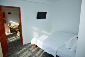Giường trong phòng chung tại AGP home