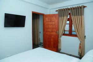 Giường trong phòng chung tại AGP home