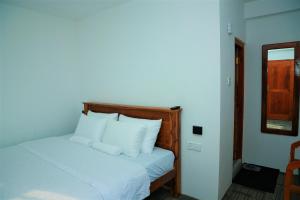 Giường trong phòng chung tại AGP home