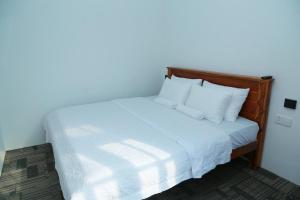 Giường trong phòng chung tại AGP home