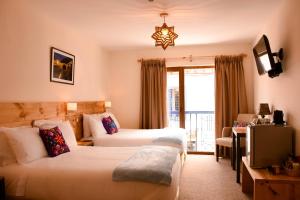 Cama ou camas em um quarto em Cooper Hotel Boutique