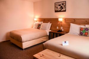 Cama ou camas em um quarto em Cooper Hotel Boutique