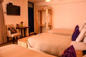 Cama ou camas em um quarto em Cooper Hotel Boutique