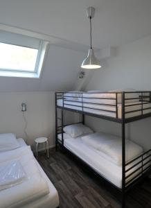 Двох'ярусне ліжко або двоярусні ліжка в номері Vakantiehuizen 't Centrum