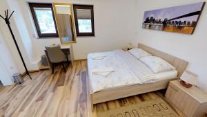 Postel nebo postele na pokoji v ubytování Čuček Guesthouse