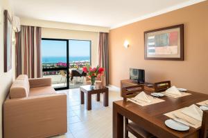 a living room with a couch and a table at Cerro Mar Atlantico & Cerro Mar Garden in Albufeira