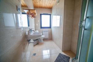 a bathroom with a sink and a toilet at Pod Hawraniem pokoje z widokiem na Tatry Ski & Bike Friendly Jurgów in Jurgów +31 photos