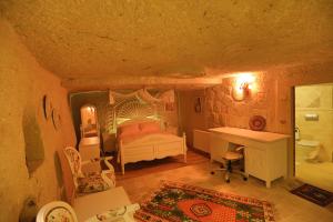 Postel nebo postele na pokoji v ubytování Iris Cave Cappadocia