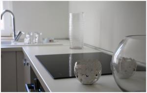 a kitchen with a sink and two vases on a counter at Holiday Home Ante in Primošten +39 photos