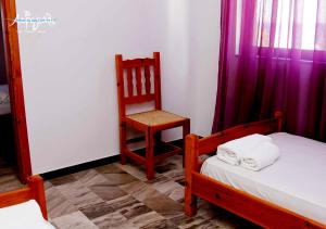 Postel nebo postele na pokoji v ubytování Akrogiali Hotel Restaurant