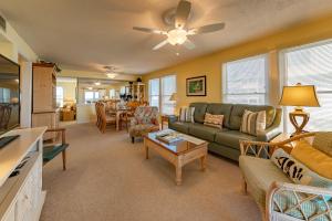 a living room with a couch and a table at Shore Fun in Kill Devil Hills