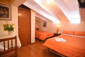 Rúm í herbergi á Tambo Cusco Inn