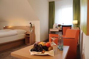 Postel nebo postele na pokoji v ubytování Hotel Ratskeller