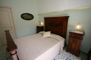 Postel nebo postele na pokoji v ubytování Sorrento Inn Guesthouse