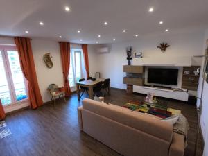 a living room with a couch and a table at Rigoletto Massena in Nice