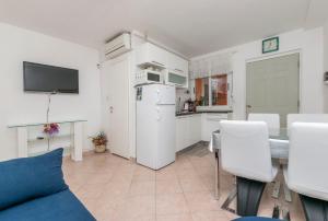 Kuchyň nebo kuchyňský kout v ubytování Apartments Slavomir