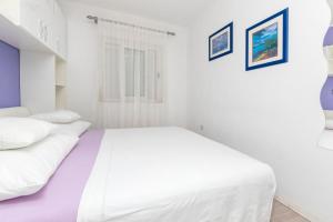 Postel nebo postele na pokoji v ubytování Apartments Slavomir