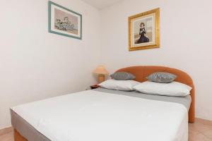 Postel nebo postele na pokoji v ubytování Apartments Slavomir