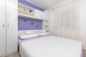 Postel nebo postele na pokoji v ubytování Apartments Slavomir