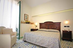 Postel nebo postele na pokoji v ubytování Sorrento Inn Guesthouse