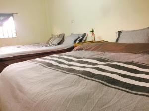 Postel nebo postele na pokoji v ubytování Bao Loc Homestay