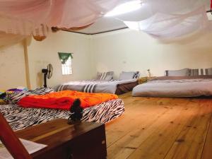 Postel nebo postele na pokoji v ubytování Bao Loc Homestay