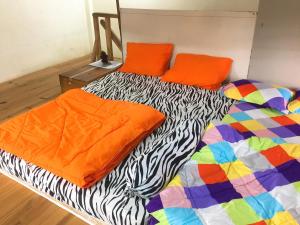 Postel nebo postele na pokoji v ubytování Bao Loc Homestay