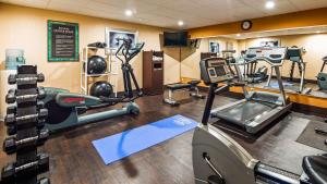 a gym with treadmills and machines in a room at Best Western Cape Cod Hotel in Hyannis