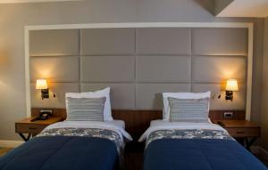 A bed or beds in a room at Ramada by Wyndham Sakarya Hendek