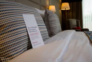 A bed or beds in a room at Ramada by Wyndham Sakarya Hendek