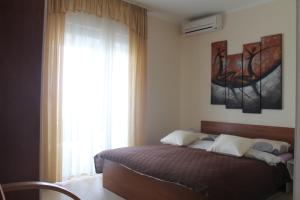 Postel nebo postele na pokoji v ubytování Apartments Roko Kolinda