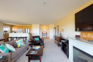 a living room with a couch and a table at Westhaven Park View in Westport