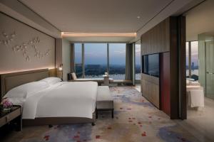 Voodi või voodid majutusasutuse InterContinental Quanzhou by IHG toas