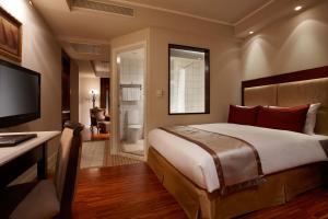 Tempat tidur dalam kamar di Hualien Charming City Hotel
