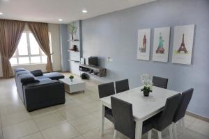 a living room with a couch and a table at PM Octagon Ipoh Suites & Apartment 2 in Ipoh