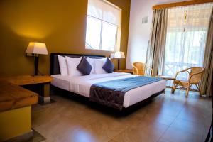 Letto o letti in una camera di Amaranthe Bay Resort & Spa