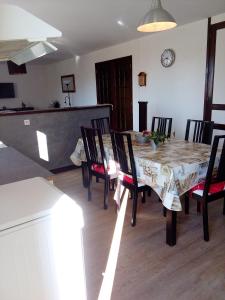 a dining room with a table and chairs at gite les chaumeix in Prondines