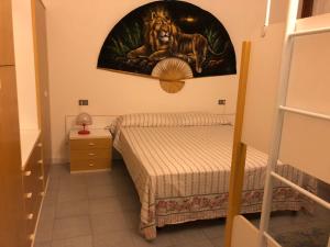 A bed or beds in a room at Trilocale I Fari
