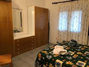 A bed or beds in a room at Trilocale I Fari