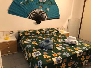A bed or beds in a room at Trilocale I Fari