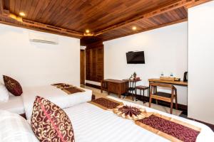 Postel nebo postele na pokoji v ubytování P5 Angkor Residence