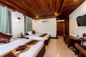 Postel nebo postele na pokoji v ubytování P5 Angkor Residence