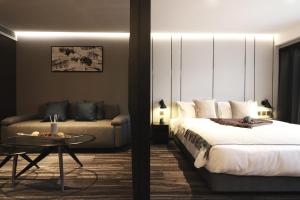 Ein Bett oder Betten in einem Zimmer der Unterkunft Hotel COZi Oasis