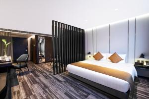 Ein Bett oder Betten in einem Zimmer der Unterkunft Hotel COZi Oasis