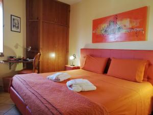 Postel nebo postele na pokoji v ubytování B&B Domus Traiani Benevento