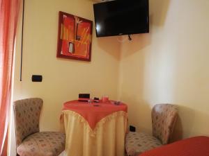 TV a/nebo společenská místnost v ubytování B&B Domus Traiani Benevento