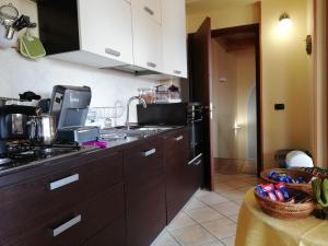 Kuchyň nebo kuchyňský kout v ubytování B&B Domus Traiani Benevento
