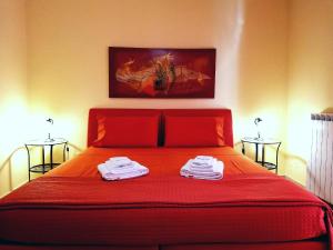 Postel nebo postele na pokoji v ubytování B&B Domus Traiani Benevento